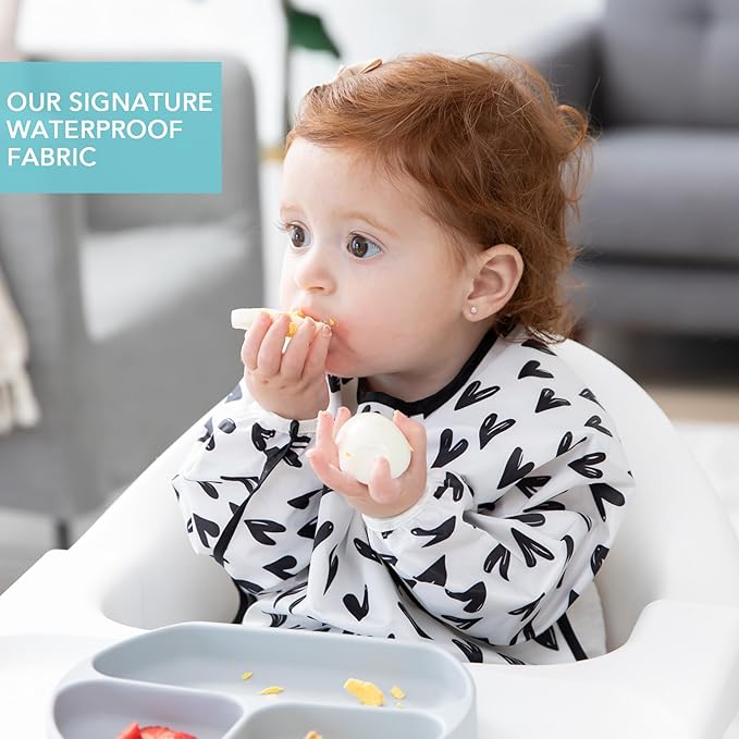 Bumkins - SuperBibs + Sleeved Bib - For Boys & Girls, Babies & Toddlers 6-24 Months - Lightweight, Durable, Waterproof - Catch-All Pocket - Wipeable & Machine Washable - Black Hearts on White - 3 Pack