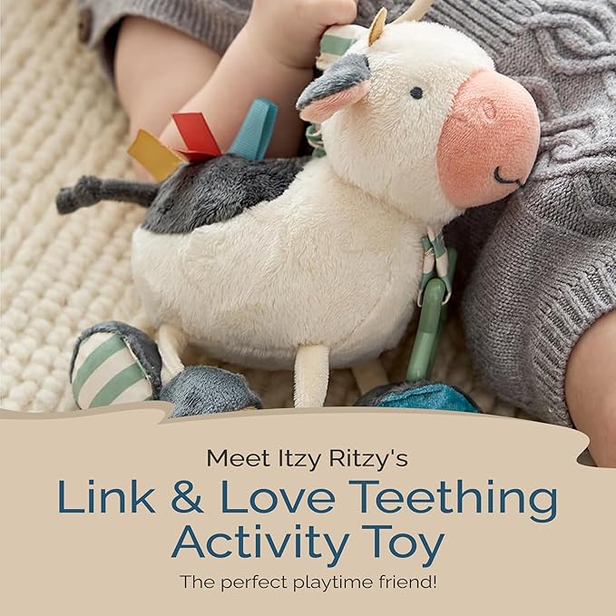 Itzy Ritzy Link & Love Toy for Stroller or Car Seat; Features Textured Ribbons, Crinkle Sounds, Clinking Rings & Silicone Teether; Designed for Ages 0 Months and Up (Cow)