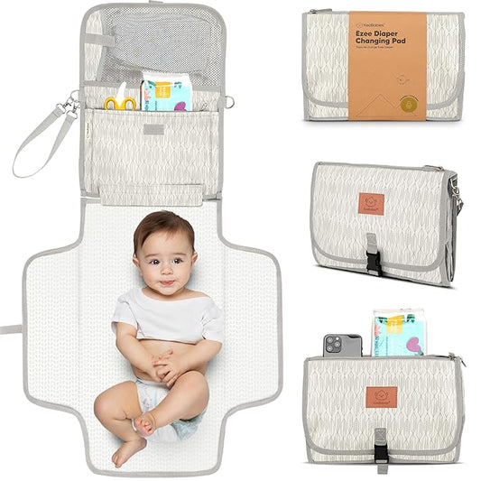 KeaBabies Portable Diaper Changing Pad - Large Waterproof Baby Changing Mat, Compact Travel Diaper Clutch, Functional Pockets Fit Newborn Essentials, Wipeable & Padded Baby Changer (Prism)