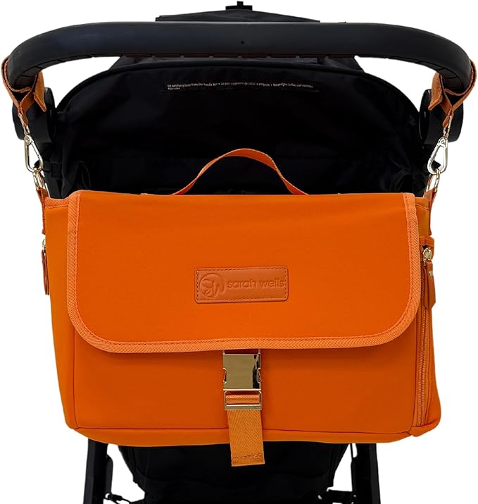 Sarah Wells Stroller Caddy & Pump Bag – Insulated Neoprene Diaper Organizer with Crossbody Strap, Machine Washable, Luggage Sleeve – Fits Single & Double Strollers (Orange)