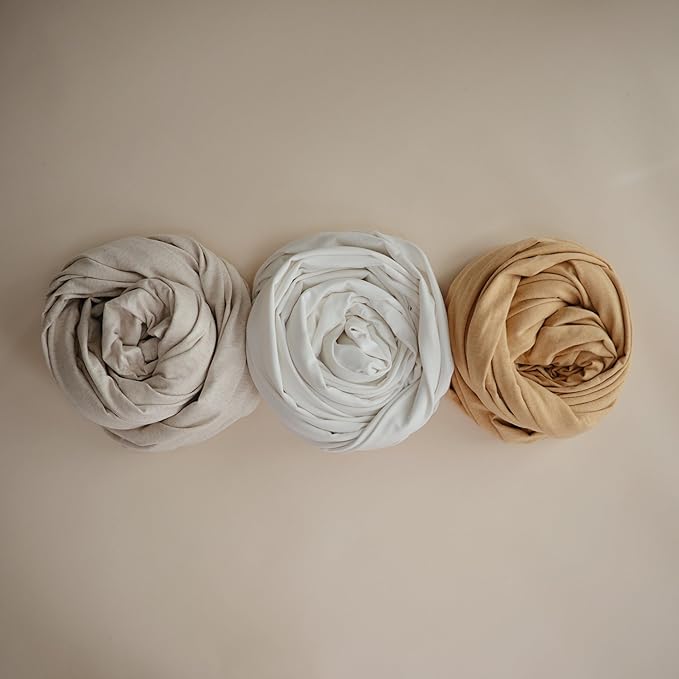 mushie Baby Wrap Carrier | Organic Cotton and Elastane | Infant Sling for Newborn and Babies 8-35 lbs (Ivory)