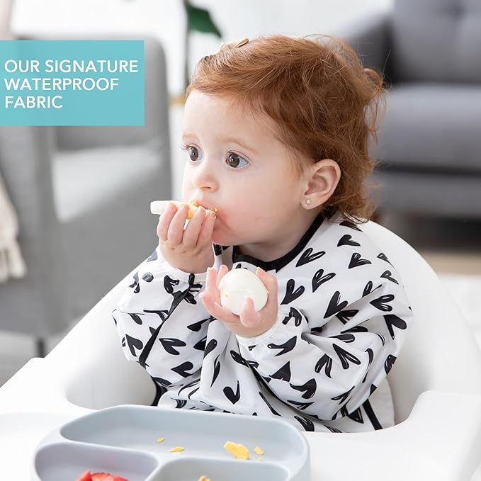 Bumkins Sleeved Bib for Girl or Boy, Baby and Toddler for 6-24 Months, Essential Must Have for Eating, Feeding, Baby Led Weaning Supplies, Long Sleeve Mess Saving Food Catcher, Hearts Black and White