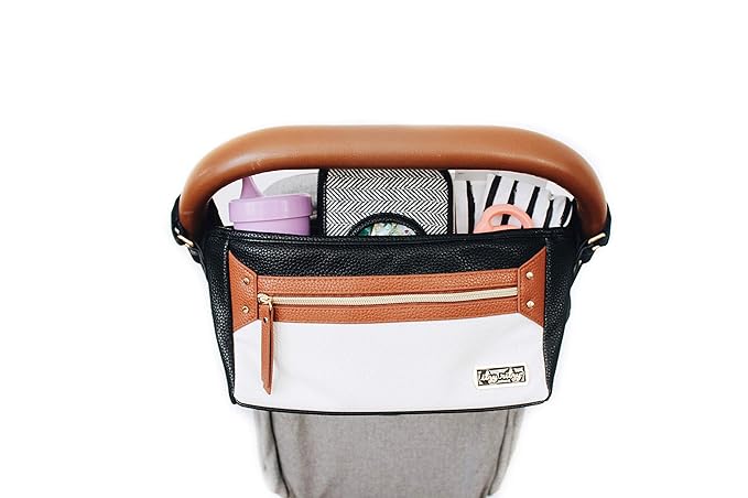 Itzy Ritzy Adjustable Stroller Caddy and Organizer Bag Featuring Front Zippered Pocket, 2 Built-In Interior Pockets & Adjustable Straps to Fit Nearly Any Stroller (Coffee and Cream)