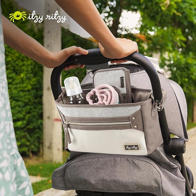 Itzy Ritzy Adjustable Stroller Caddy and Organizer Bag Featuring Front Zippered Pocket, 2 Built-In Interior Pockets & Adjustable Straps to Fit Nearly Any Stroller (Vanilla Latte)